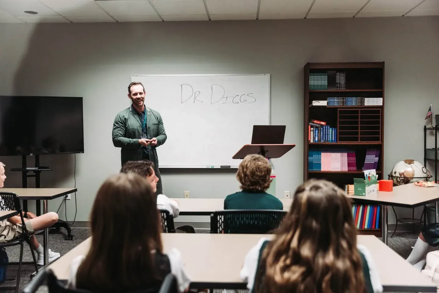 A teacher leading his cohort